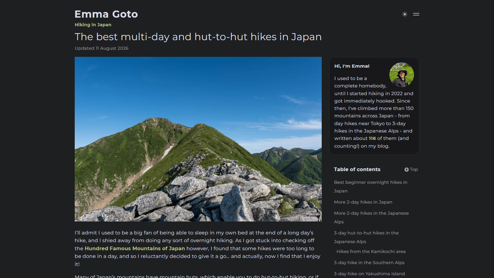 Dark-themed blog page headed 'The best multi-day and hut-to-hut hikes in Japan', updated 11 August 2026, above a photograph of a green ridgeline in the Japanese Alps with a boulder-strewn summit in the foreground under a clear blue sky; the sidebar shows an author portrait and a contents list of 2-day and 3-day hikes